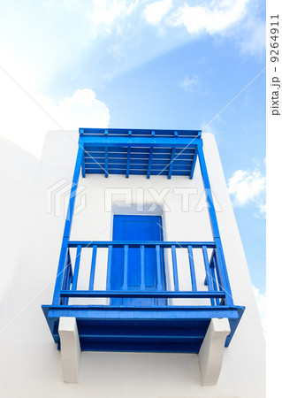 Blue colonial door on a wall Blue colonial door on a wall 9264911