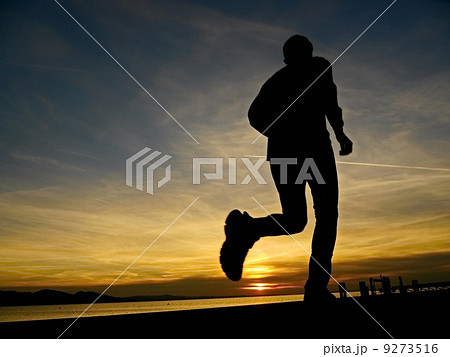 silhouette of a jogger in sunrise silhouette of a jogger in sunrise 9273516