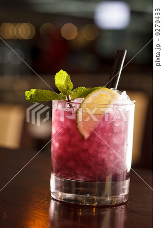 cocktail with blackberries and straw 9279433