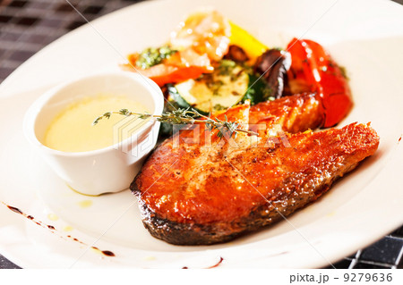 salmon steak with vegetables salmon steak with vegetables 9279636