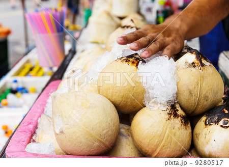 Young coconut drinks on street 9280517