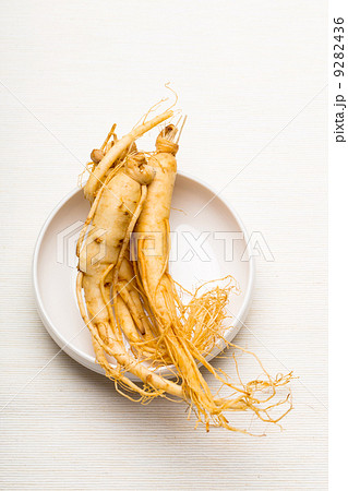 Fresh ginseng on the white bowl 9282436