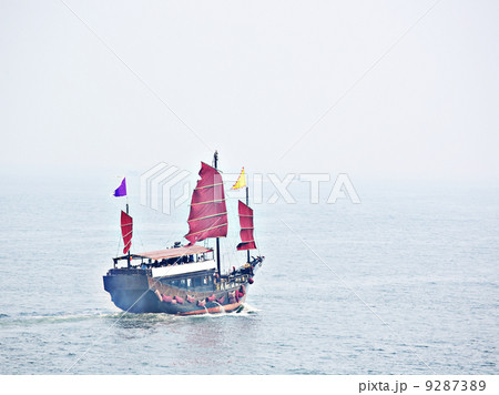 red sail boat in Hong Kong 9287389