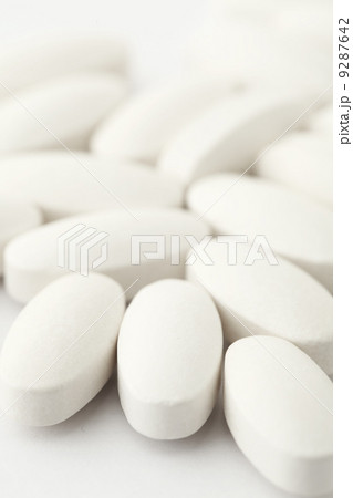 white medical tablets over white 9287642