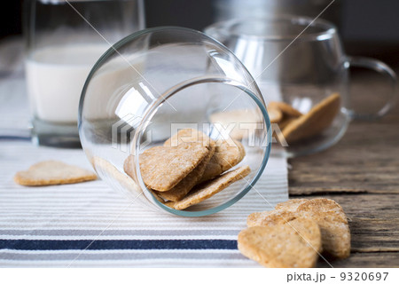 Cookies Hearts in Jar with milk on Wooden Table 9320697