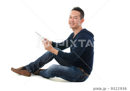 asian chinese man with a tablet in casual asian chinese man with a tablet in casual 9322936