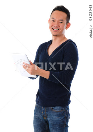 happy asian male on a generic tablet happy asian male on a generic tablet 9322943