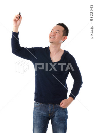 asian male writing something on glass board with marker 9322945