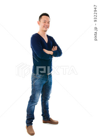 Asian man looking at camera against white background Asian man looking at camera against white background 9322947