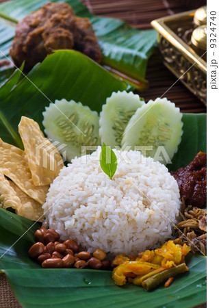 nasi lemak, a traditional malay curry paste rice dish served on nasi lemak, a traditional malay curry paste rice dish served on 9324740