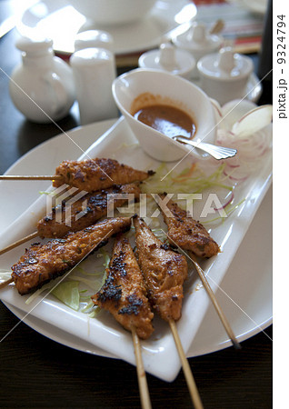 Delicious chicken satay on skewers Delicious chicken satay on skewers 9324794