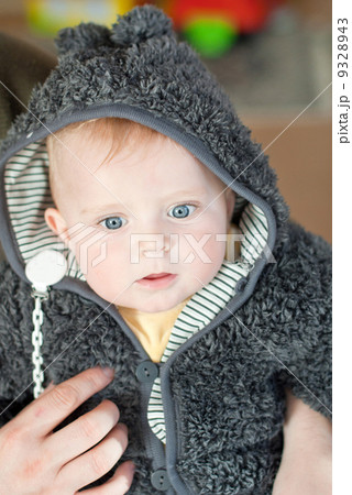 Sweet baby boy in warm winter clothes 9328943