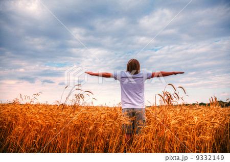Young man staying with stretched out hands 9332149