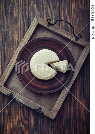 Round cheese on vintage tray 9335055
