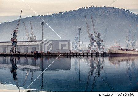 Industrial zone seaport with cranes in the fog Industrial zone seaport with cranes in the fog 9335566