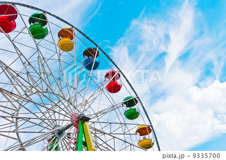Colorful ferris wheel on blue sky background 9335700