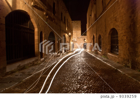 Medieval Avenue of the Knights at night, a cobblestone street in Rhodes Citadel , Greece 9339259