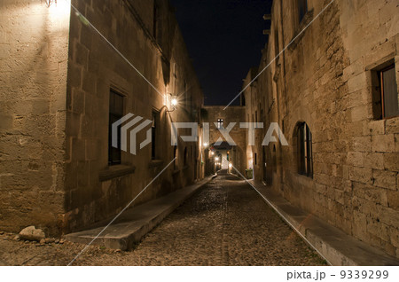Medieval Avenue of the Knights at night, a cobblestone street in Rhodes Citadel , Greece Medieval Avenue of the Knights at night, a cobblestone street in Rhodes Citadel , Greece 9339299