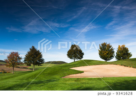 Autumn on the golf course in the mist at sunrise Autumn on the golf course in the mist at sunrise 9341628