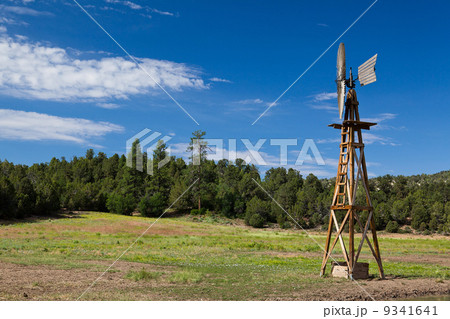 Old fashioned country windmill for pumping water Old fashioned country windmill for pumping water 9341641