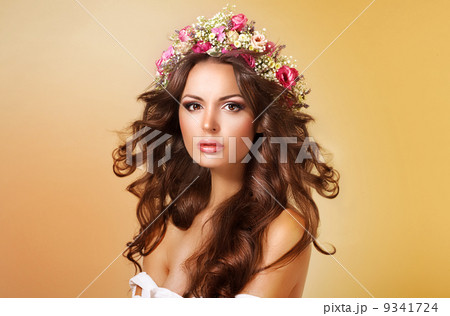 Elegance. Classy Adorable Lady with Flowers and Flowing Hair 9341724