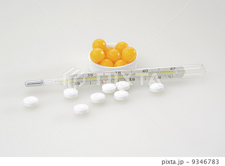 The thermometer, vitamins and pills  9346783