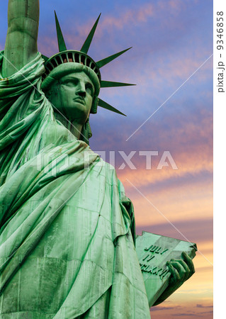 Statue of Liberty under colorful sky 9346858