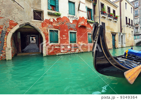 Gondola on small canal in Venice, Italy. 9349364