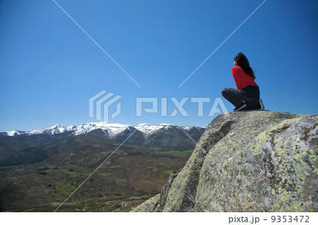 squatting at top of valley squatting at top of valley 9353472