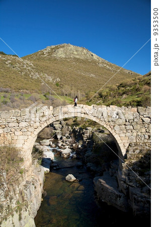 walking on ancient bridge 9353500