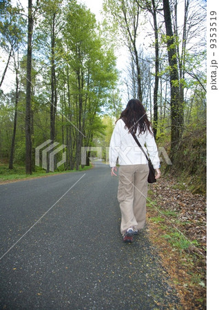 woman on a rural road 9353519