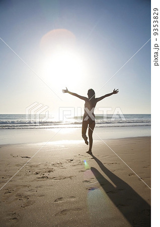 running at shore against sun 9353829
