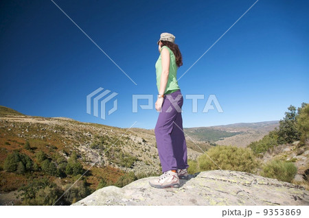 female watching back 9353869