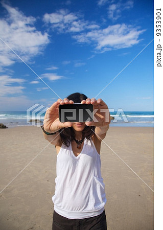 smiling woman with blank screen mobile smiling woman with blank screen mobile 9353901