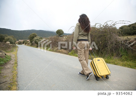 road woman and suitcase 9354062