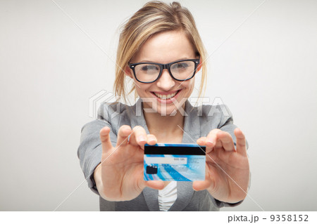 woman holding new credit card 9358152
