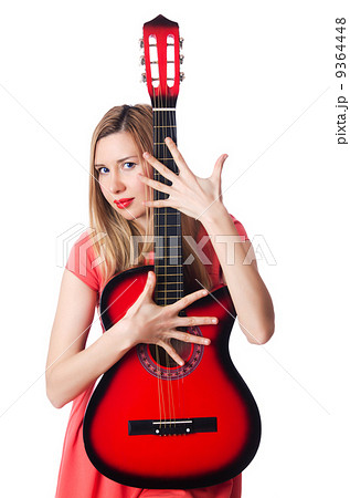 Female guitar player isolated on white 9364448
