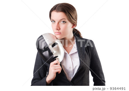 Woman with mask in hypocrisy concept Woman with mask in hypocrisy concept 9364491