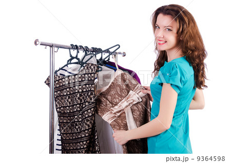 Woman trying new clothing on white Woman trying new clothing on white 9364598