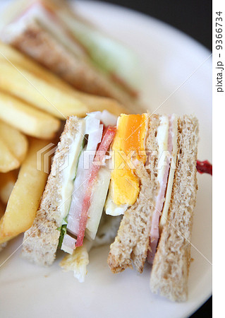 Club sandwich with on wood background 9366734