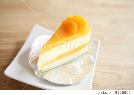 Orange cake on wood background 9366965