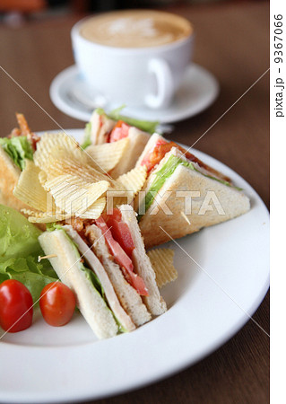 Club sandwich with coffee on wood background Club sandwich with coffee on wood background 9367066