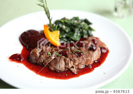 Duck confit , Roasted duck with blueberry sauce 9367615