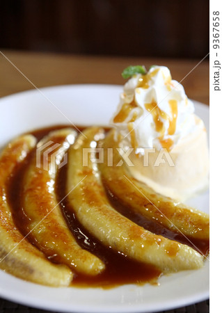 Dessert ice cream with sweet banana on wood background 9367658
