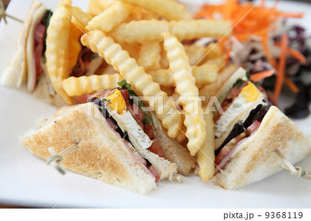 Club sandwich with on wood background Club sandwich with on wood background 9368119