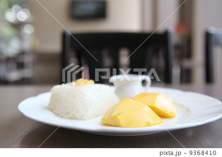 Sticky Rice with Mango on wood background Sticky Rice with Mango on wood background 9368410