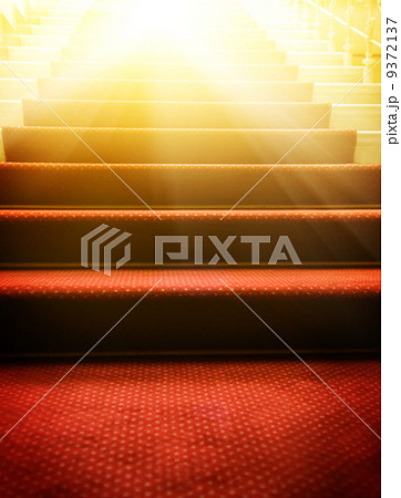 Stairs covered with red carpet 9372137