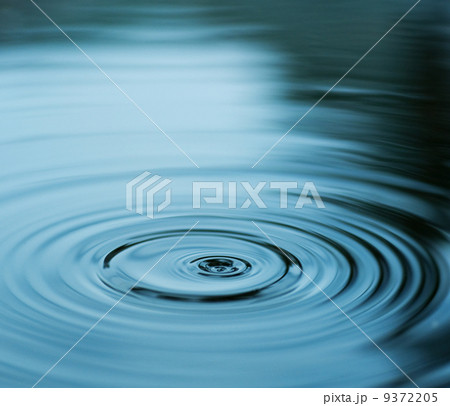 Droplet falling in blue water Droplet falling in blue water 9372205