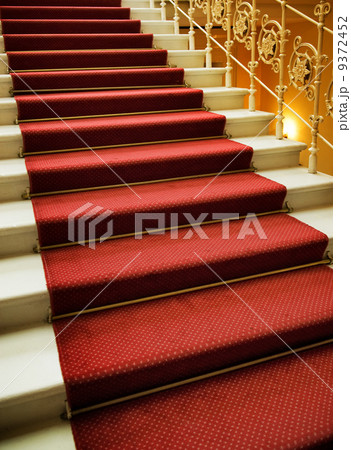 Stairs covered with red carpet Stairs covered with red carpet 9372452