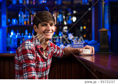 man with a cup of coffee 9373237